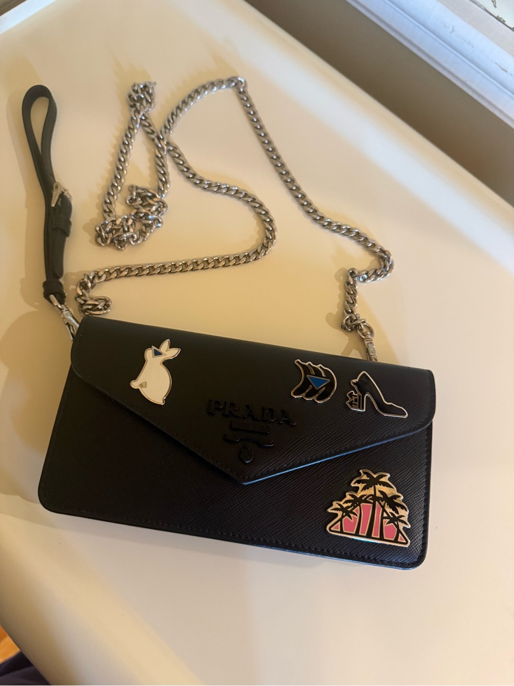 PRADA Saffiano Leather Badge Wristlet – Black